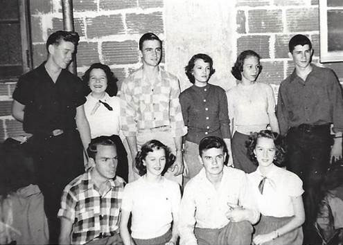 A group of people posing for a photo
Description automatically generated